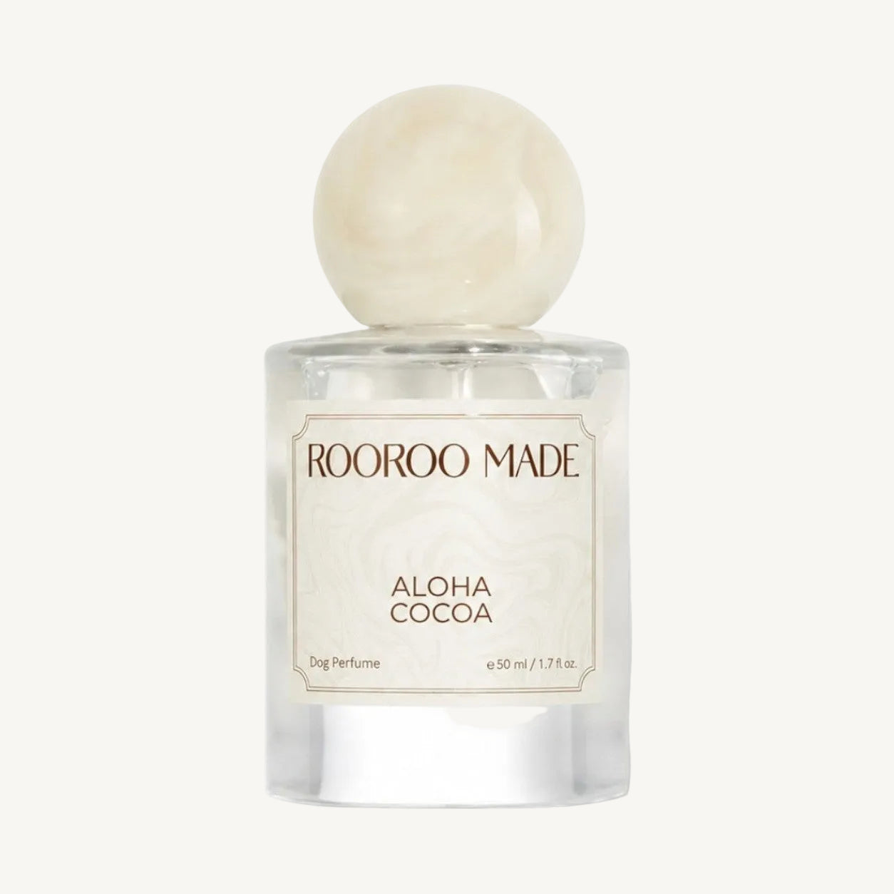 The Scented Canine Aloha Coco dog perfume in a 50ml glass bottle with a round marble-effect cap.