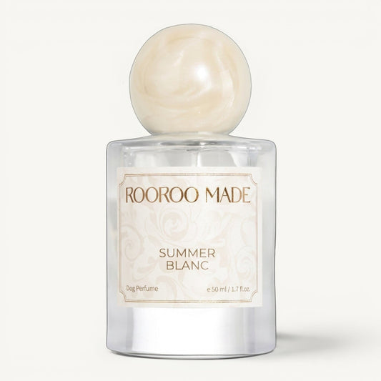 The Scented Canine Summer Blanc luxury dog perfume in a 50ml glass bottle with a decorative cream-colored cap.